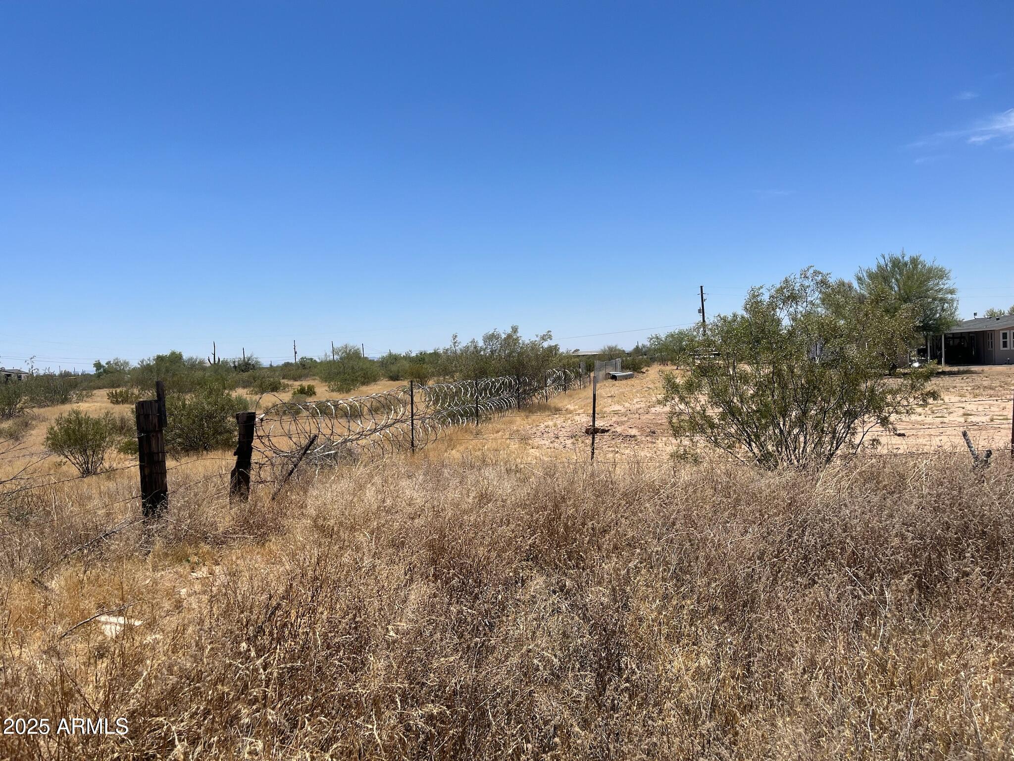 22695 East Cactus Forest Road Florence, AZ 85132 - Photo 37 of 45 a view of a lake with mountains in the background