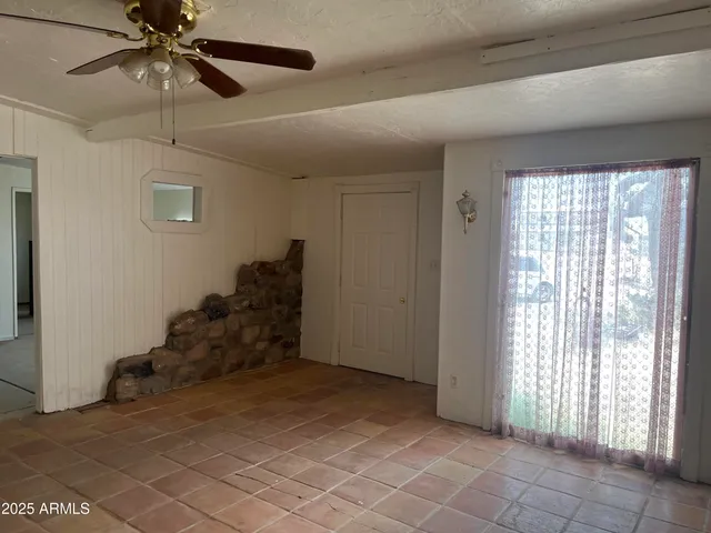 a view of empty room with windows
