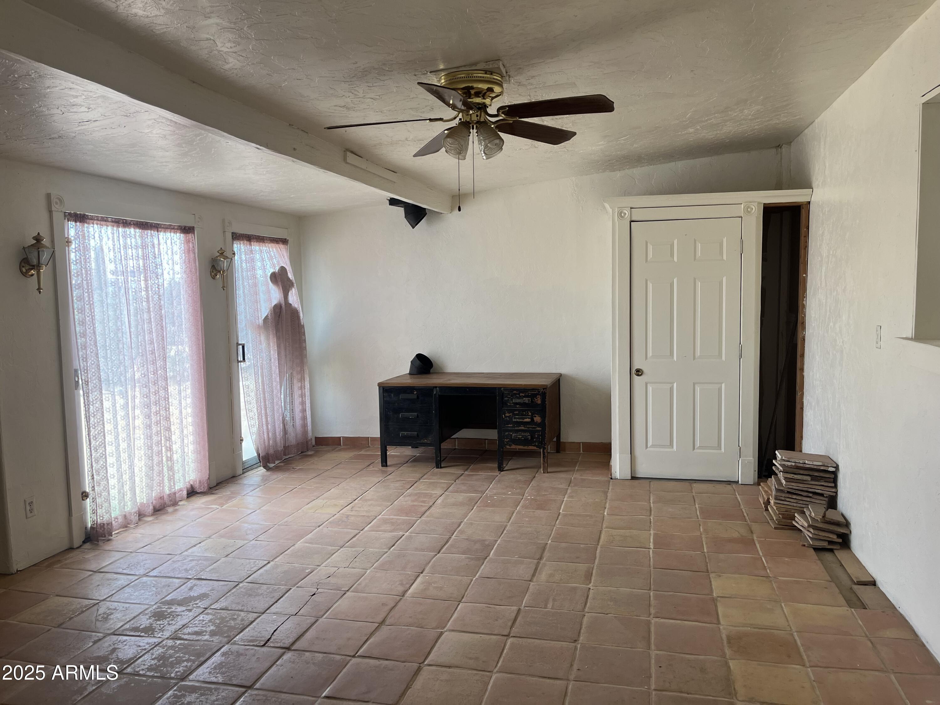22695 East Cactus Forest Road Florence, AZ 85132 - Photo 6 of 45 a view of a livingroom with furniture and a ceiling fan
