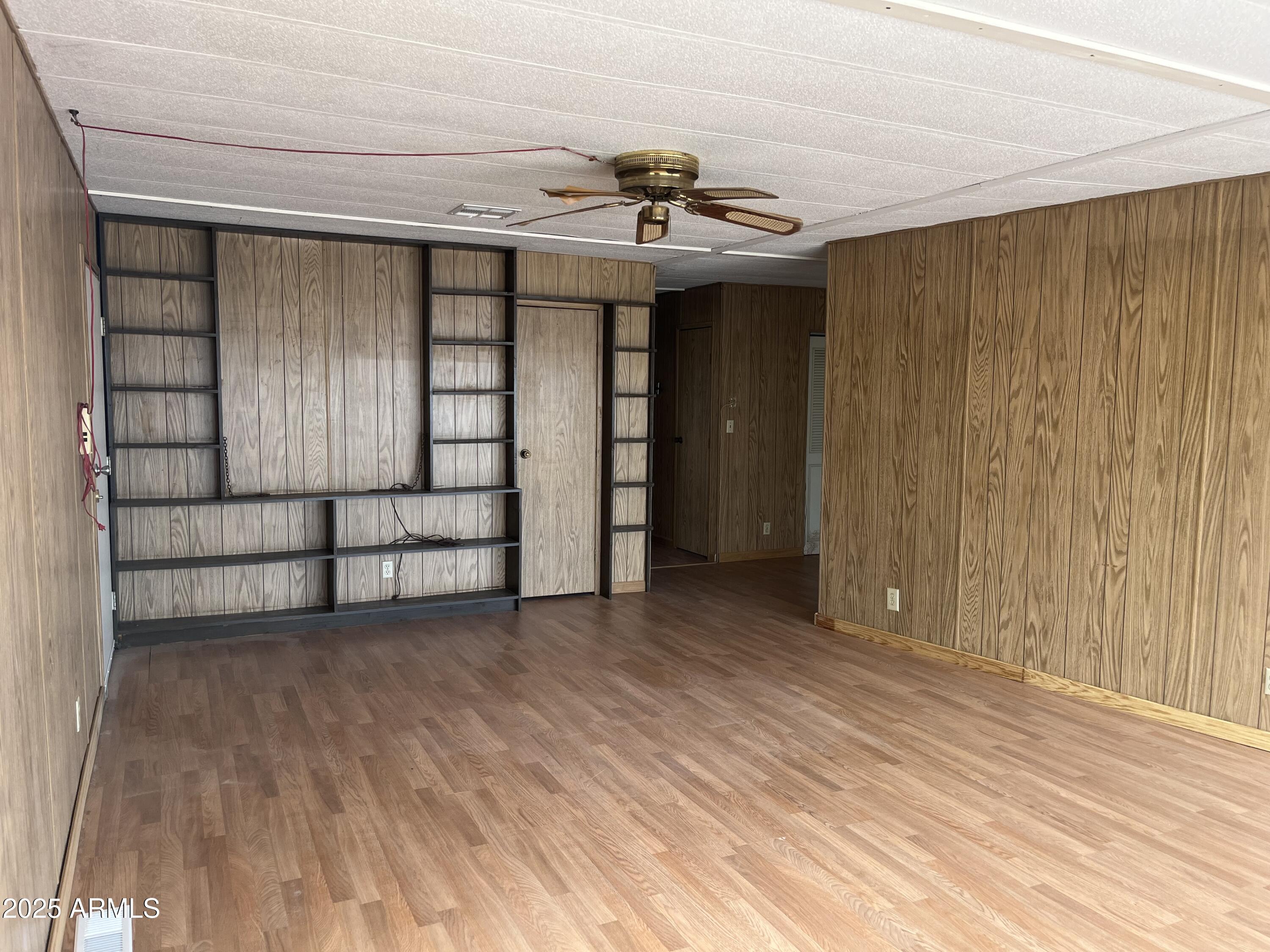 22695 East Cactus Forest Road Florence, AZ 85132 - Photo 7 of 45 a view of a room with a wooden floor and window