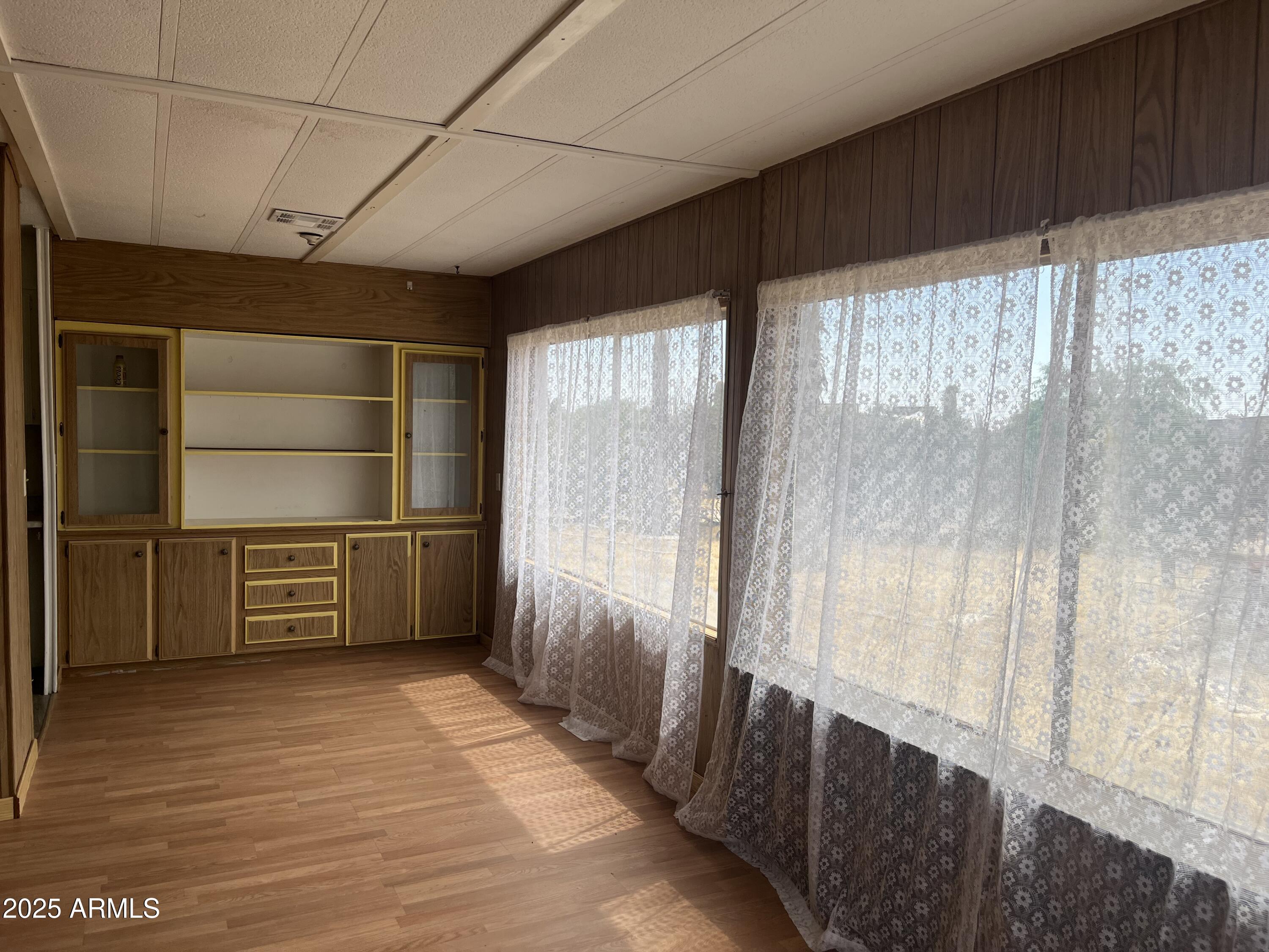 22695 East Cactus Forest Road Florence, AZ 85132 - Photo 9 of 45 a hallway with cabinets and wooden floor