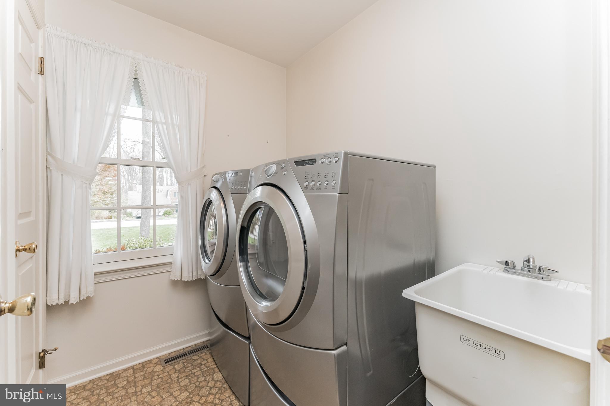 1612 Valley Greene Road Paoli, PA 19301 - Photo 14 of 30 Main level laundry room with utility sink.