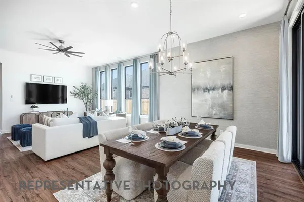 a view of a livingroom with furniture and a flat screen tv