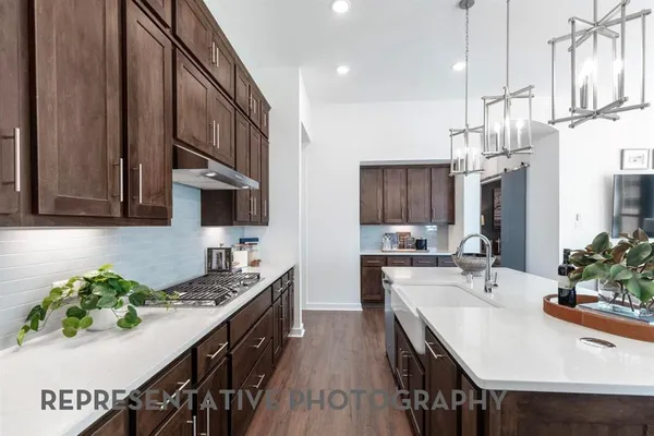 a kitchen with a sink and cabinets