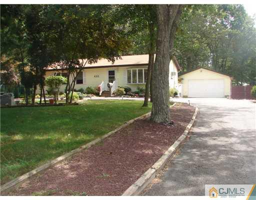 423 Monmouth Road Jackson, NJ 08527 - Photo 1 of 10 a view of a house with backyard