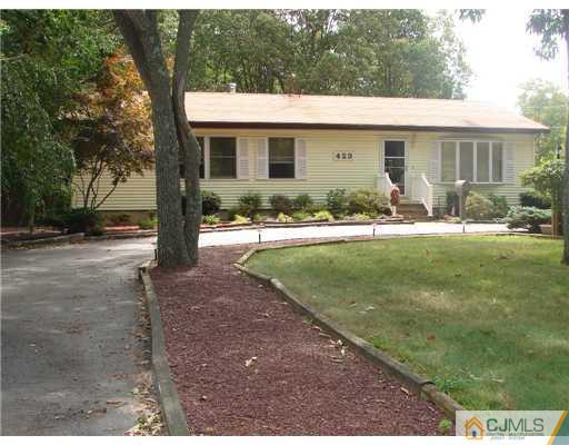 423 Monmouth Road Jackson, NJ 08527 - Photo 10 of 10 a view of a house with backyard and a tree