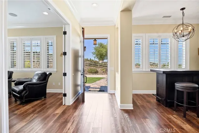 a living room with kitchen island furniture and a kitchen view