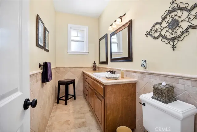 a bedroom with a bed and a table with rug