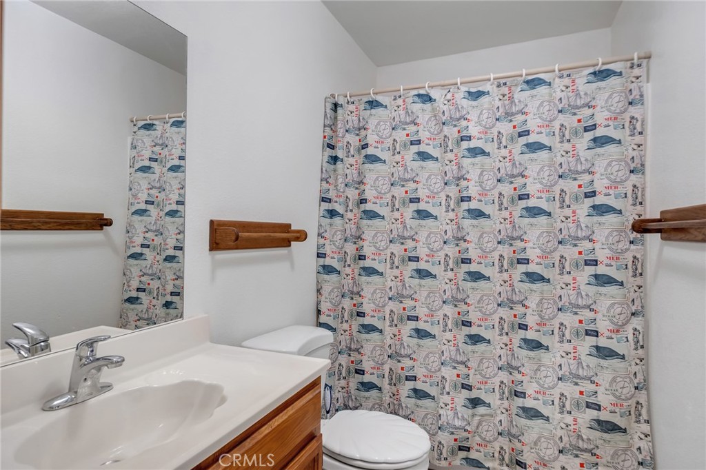12736 Oasis Road Pinon Hills, CA 92372 - Photo 14 of 33 a bathroom with a sink toilet and shower