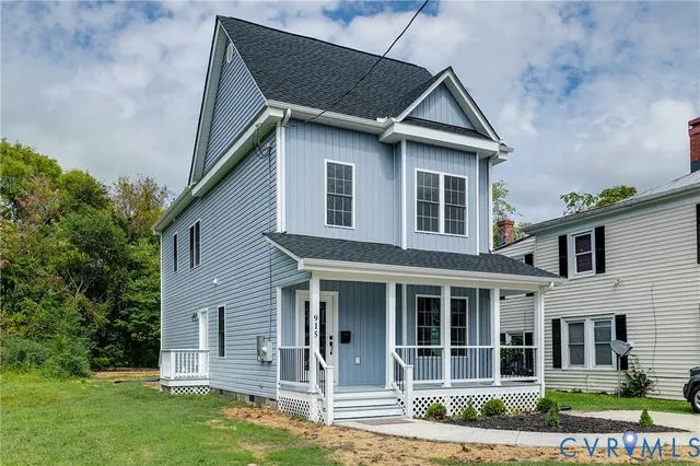 front view of a house with a yard