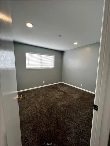 en empty room with windows