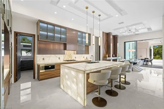 a kitchen with stainless steel appliances granite countertop a stove and a refrigerator