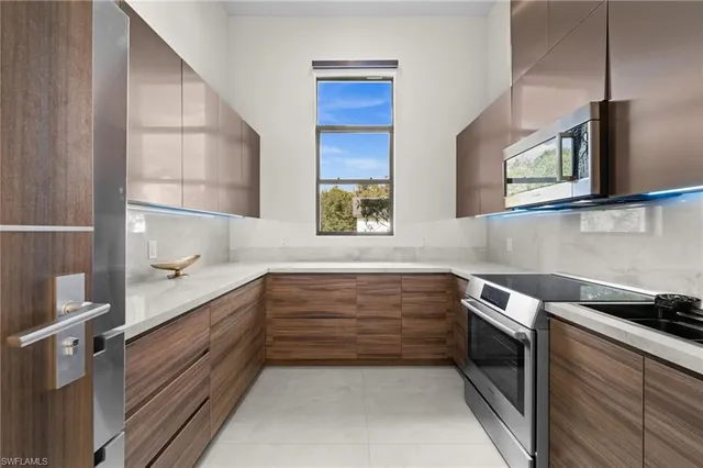 a kitchen with a sink and a microwave