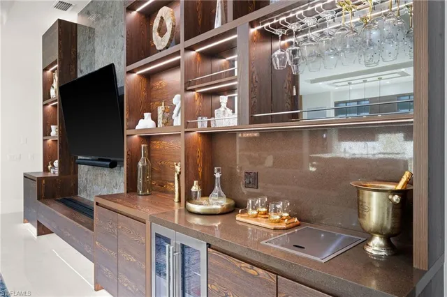 a kitchen with a refrigerator and a stove