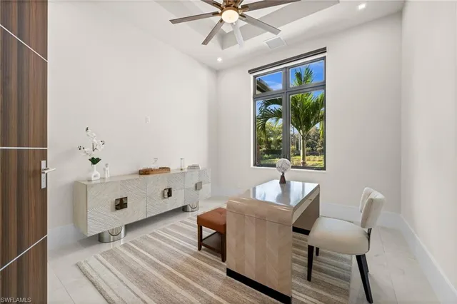 a spacious bedroom with a bed and a window