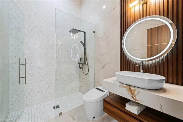 a dining room with furniture a chandelier and a rug