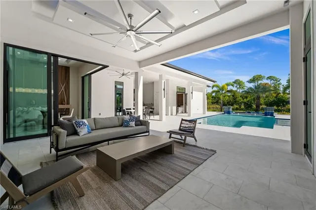 a large kitchen with a table and chairs in it
