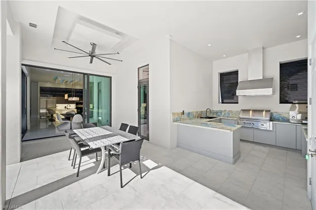 a utility room with sink dryer and washer