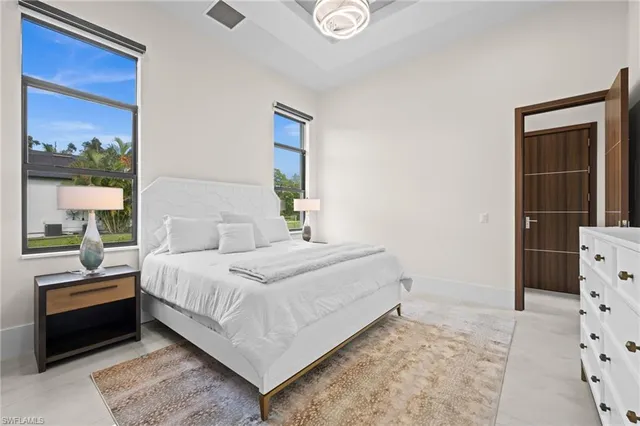 a bathroom with a toilet a sink and a mirror