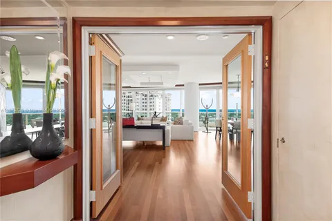 a view of living room and dining room with wooden floor