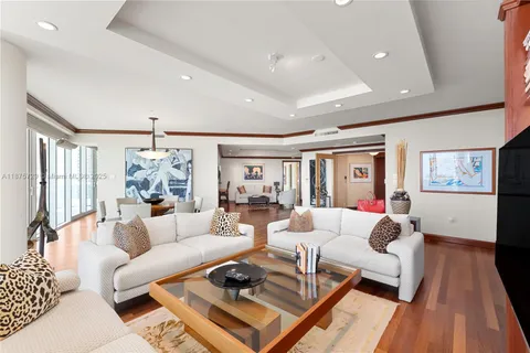 a living room with furniture rug and wooden floor
