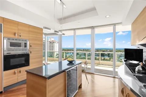 a kitchen with a large window and a sink
