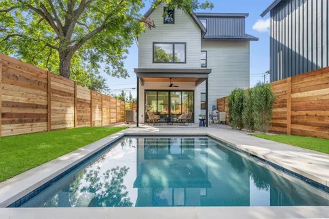 a view of swimming pool with a outdoor seating