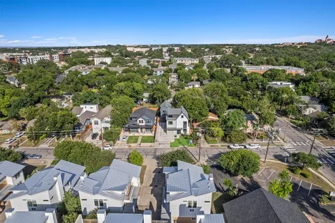 an aerial view of residential houses with outdoor space