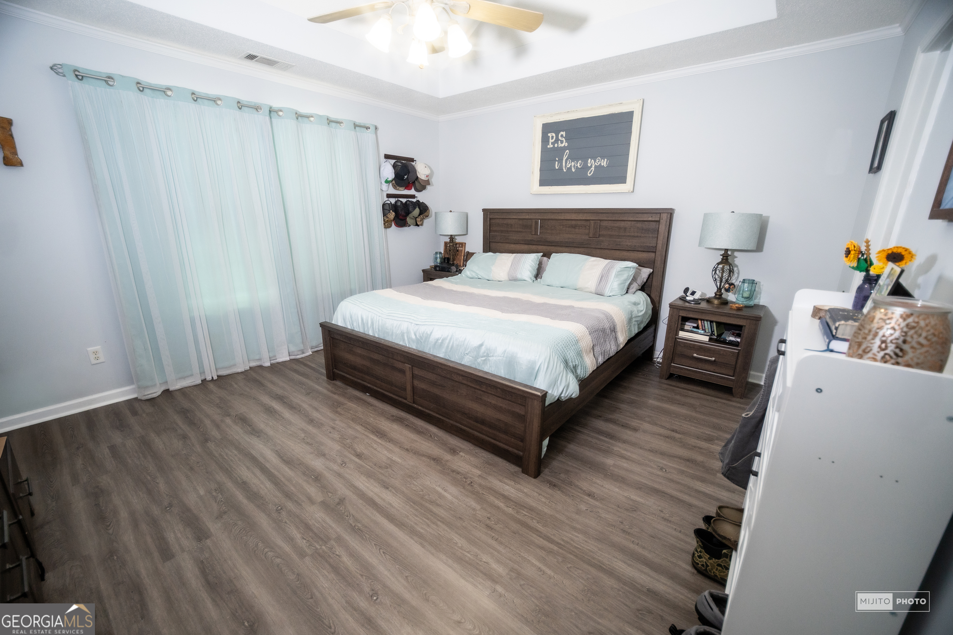 124 Austin Way Jefferson, GA 30549 - Photo 17 of 32 a bedroom with a bed and wooden floor