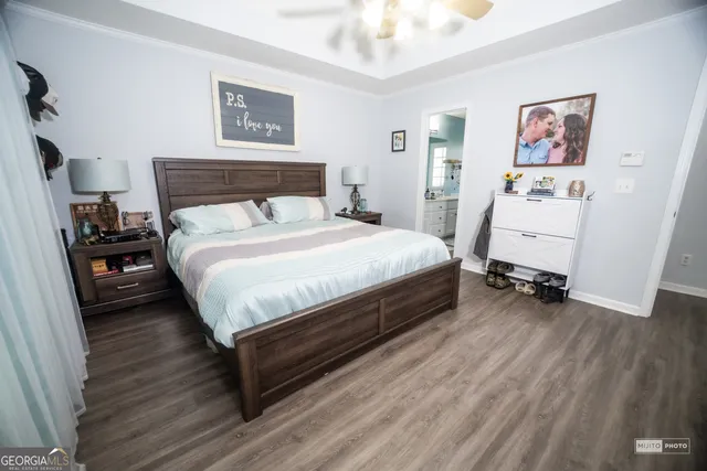 a spacious bathroom with double vanity a mirror a bathtub and a shower