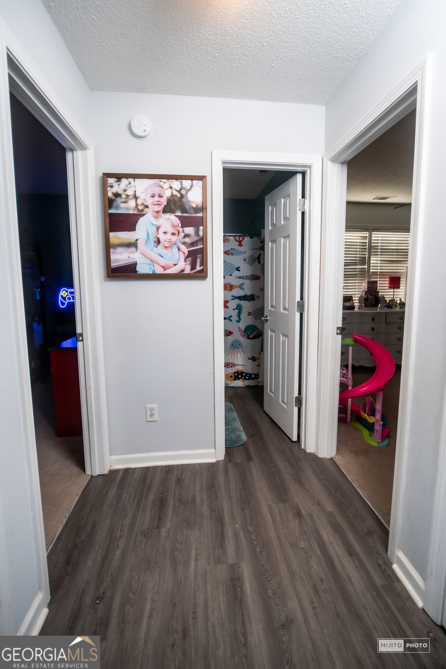 124 Austin Way Jefferson, GA 30549 - Photo 24 of 32 a view of a livingroom with wooden floor and closet