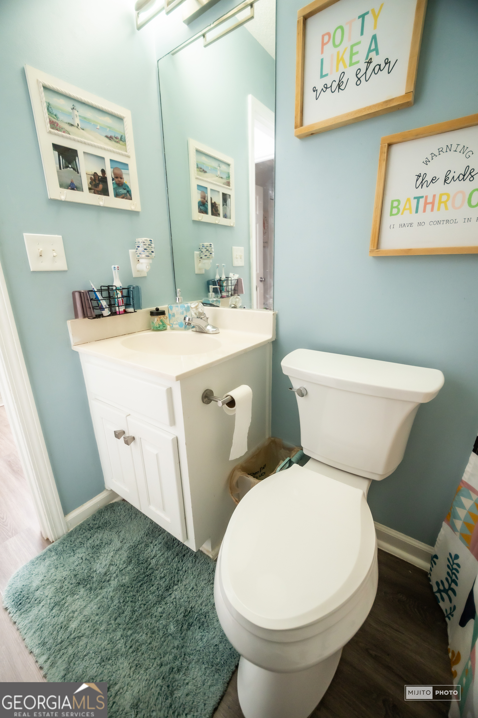 124 Austin Way Jefferson, GA 30549 - Photo 26 of 32 a white toilet sitting next to a bathroom sink