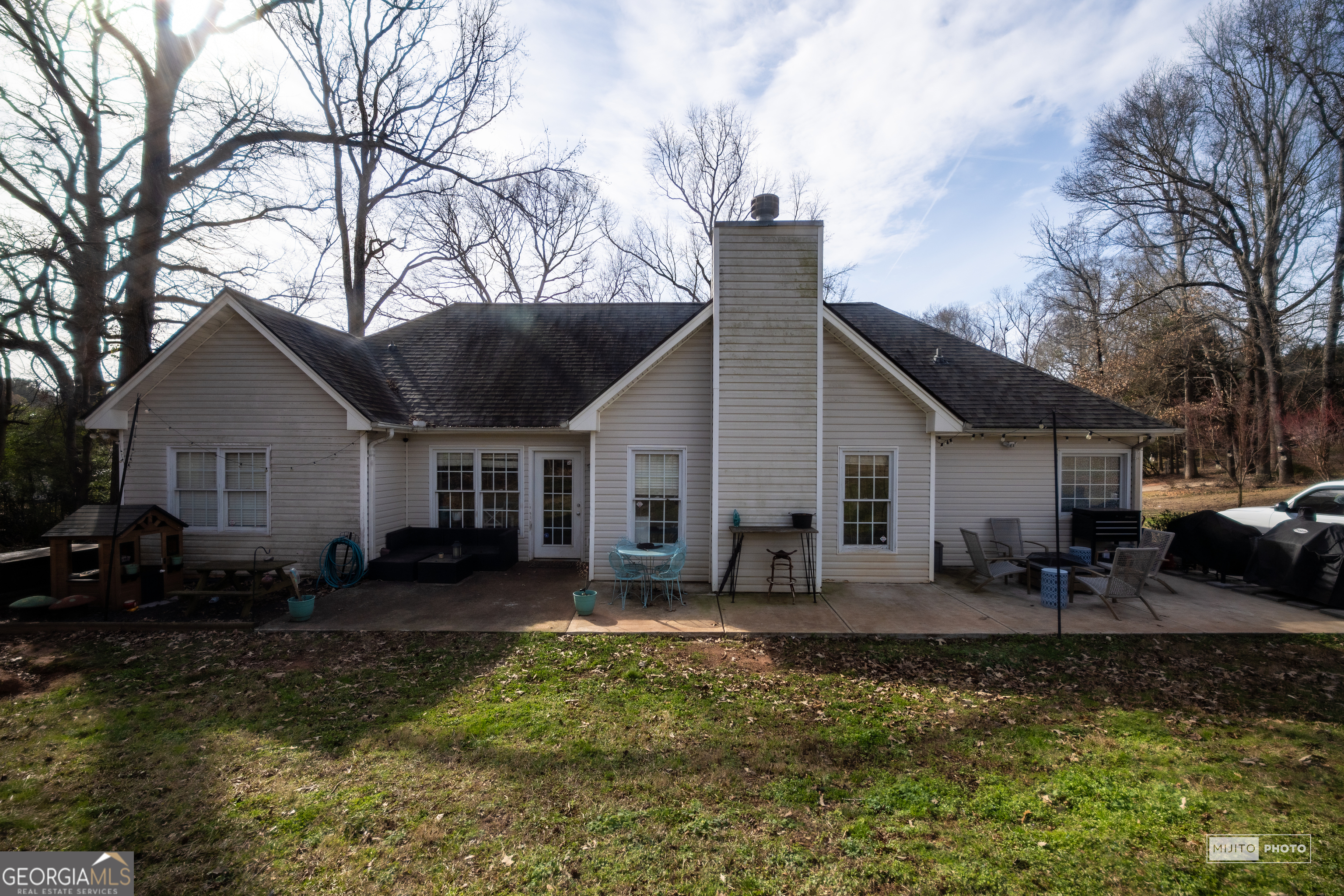 124 Austin Way Jefferson, GA 30549 - Photo 30 of 32 a view of a house with a yard chairs and wooden fence