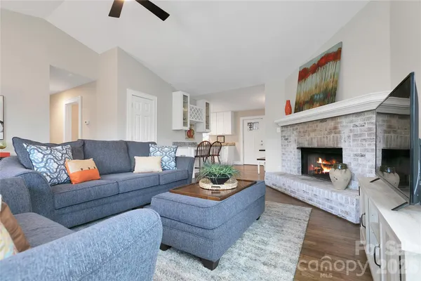 a bathroom with a granite countertop sink mirror and toilet