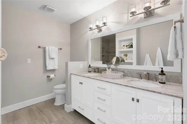 a aerial view of a chairs and table on the terrace