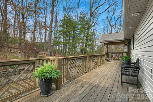 a kitchen with granite countertop white cabinets and a window