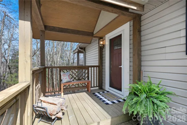 a kitchen with granite countertop a sink stainless steel appliances and white cabinets