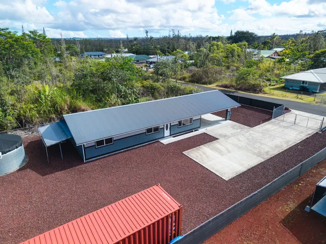 a view of a patio with couches and city view