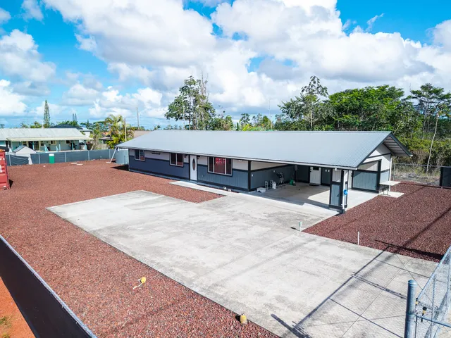 a roof deck with table and chairs