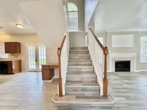 a view of entryway and hall with wooden floor