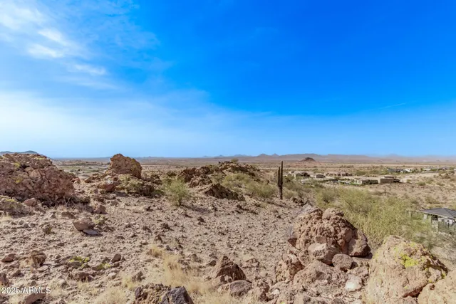 a view of a large body of water with a building in the background