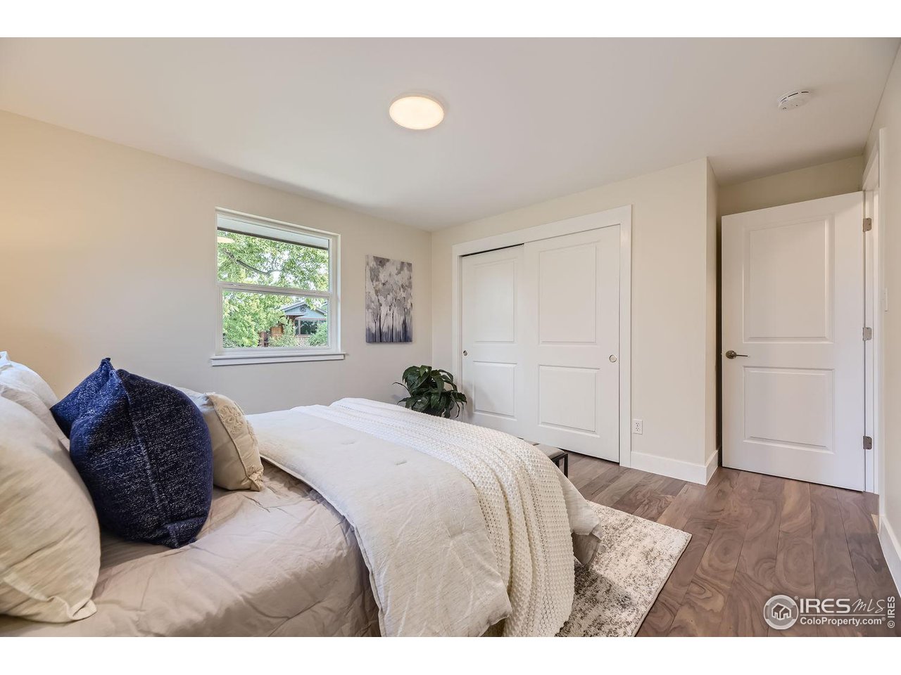1505 Findlay Way Boulder, CO 80305 - Photo 13 of 31 a bedroom with a bed and a window