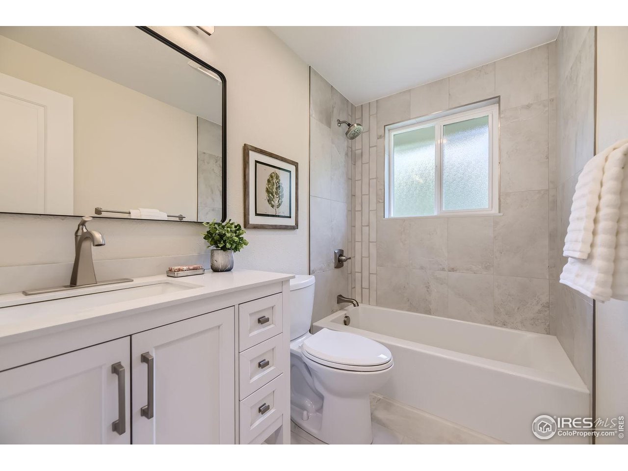 1505 Findlay Way Boulder, CO 80305 - Photo 15 of 31 a bathroom with a sink a toilet and shower