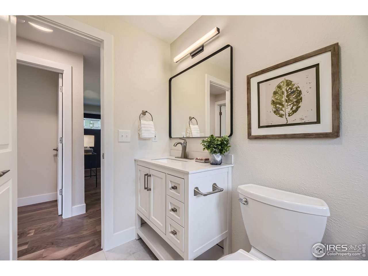 1505 Findlay Way Boulder, CO 80305 - Photo 16 of 31 a bathroom with a toilet a sink and a mirror