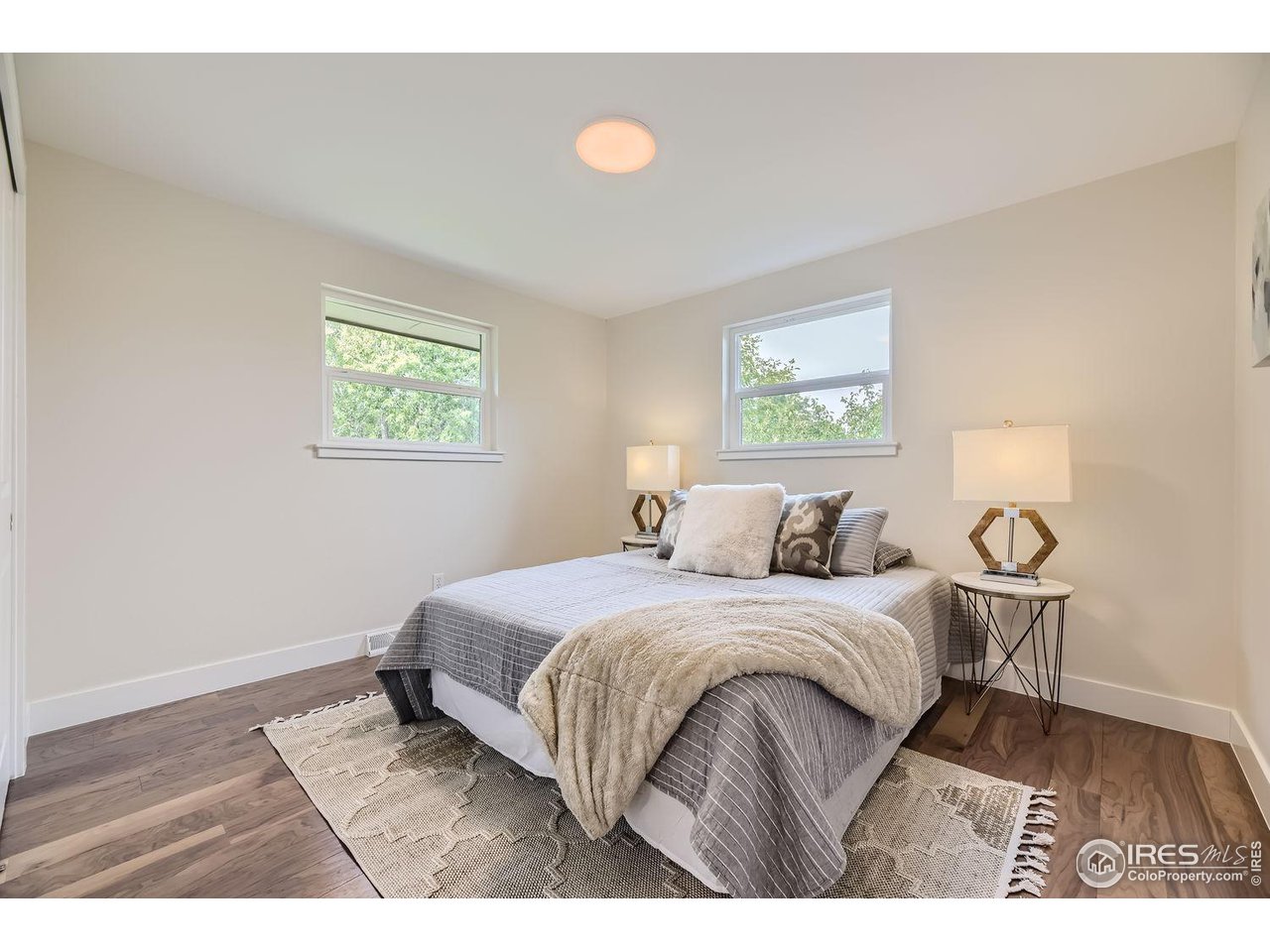 1505 Findlay Way Boulder, CO 80305 - Photo 17 of 31 a bedroom with a bed and a window