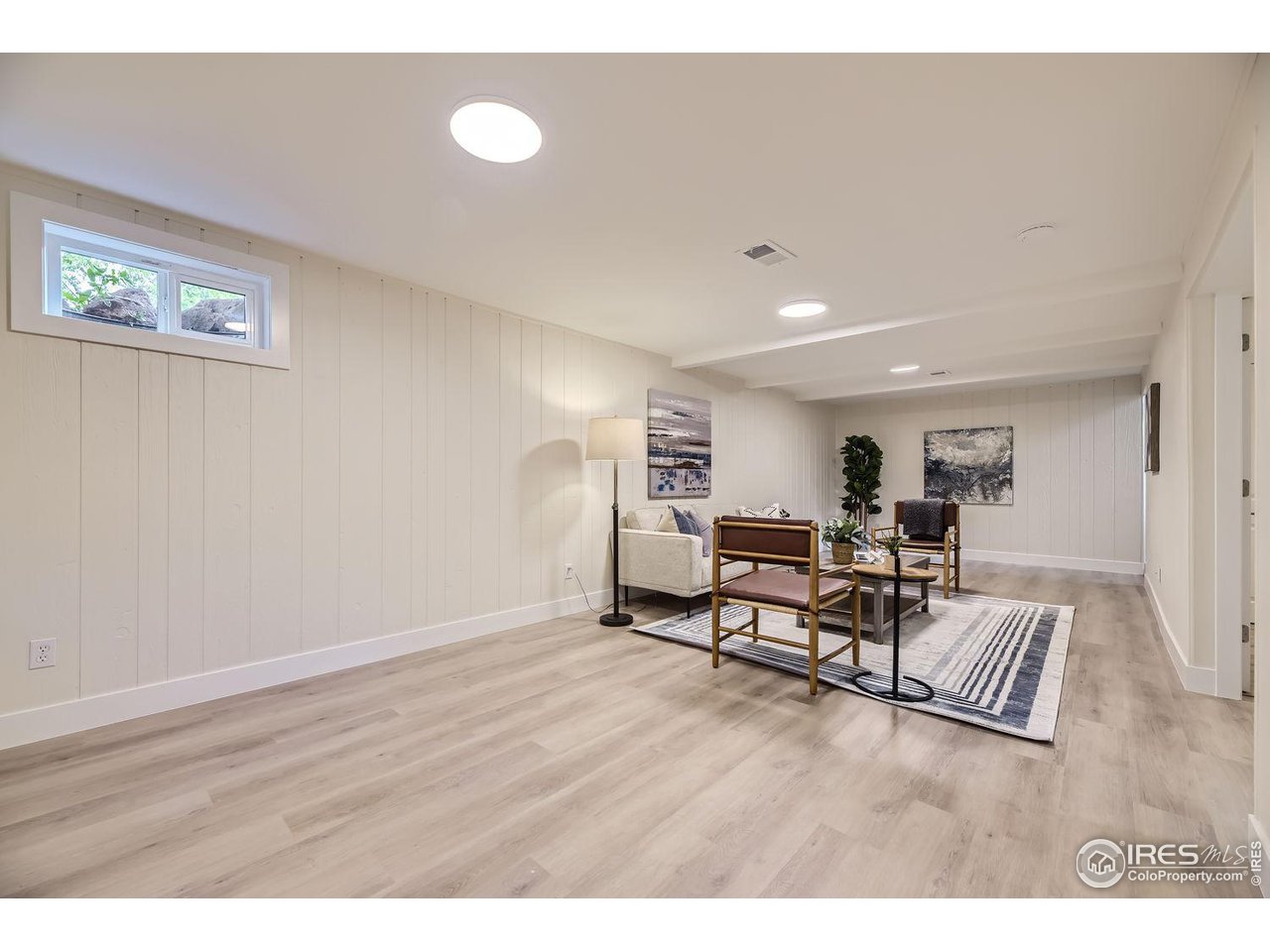 1505 Findlay Way Boulder, CO 80305 - Photo 19 of 31 a living room with furniture and a wooden floor