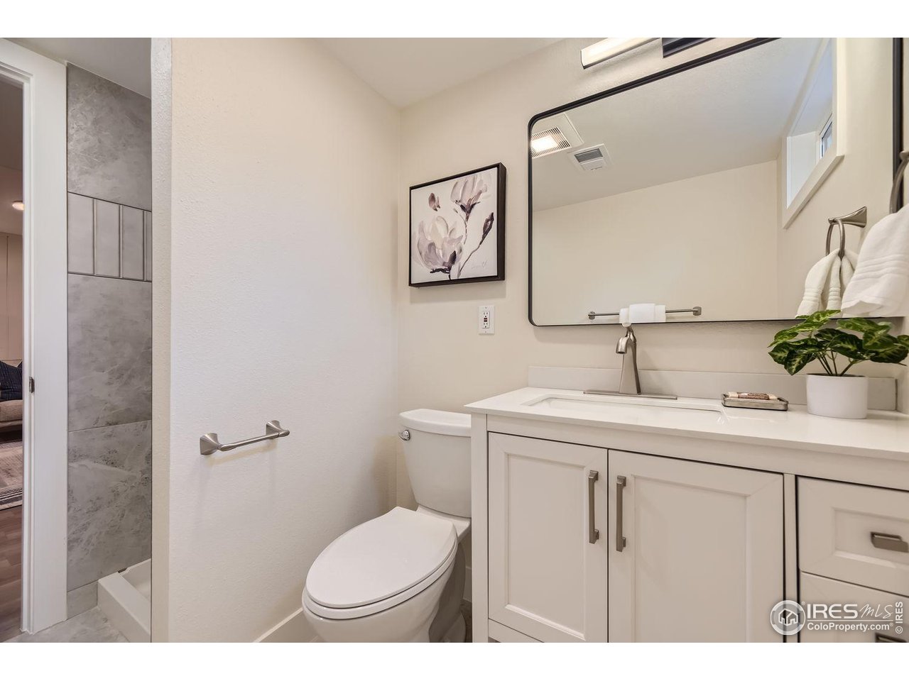 1505 Findlay Way Boulder, CO 80305 - Photo 22 of 31 a bathroom with a toilet sink and mirror