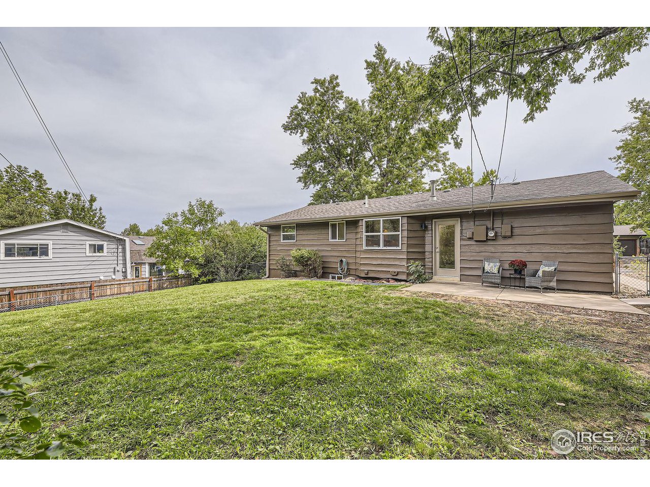 1505 Findlay Way Boulder, CO 80305 - Photo 26 of 31 a front view of a house with a garden