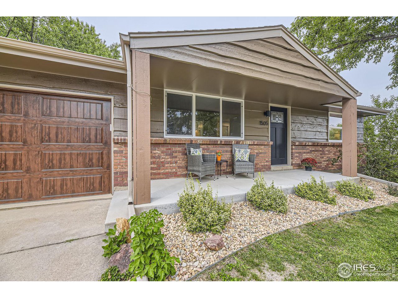1505 Findlay Way Boulder, CO 80305 - Photo 3 of 31 a front view of a house with garden