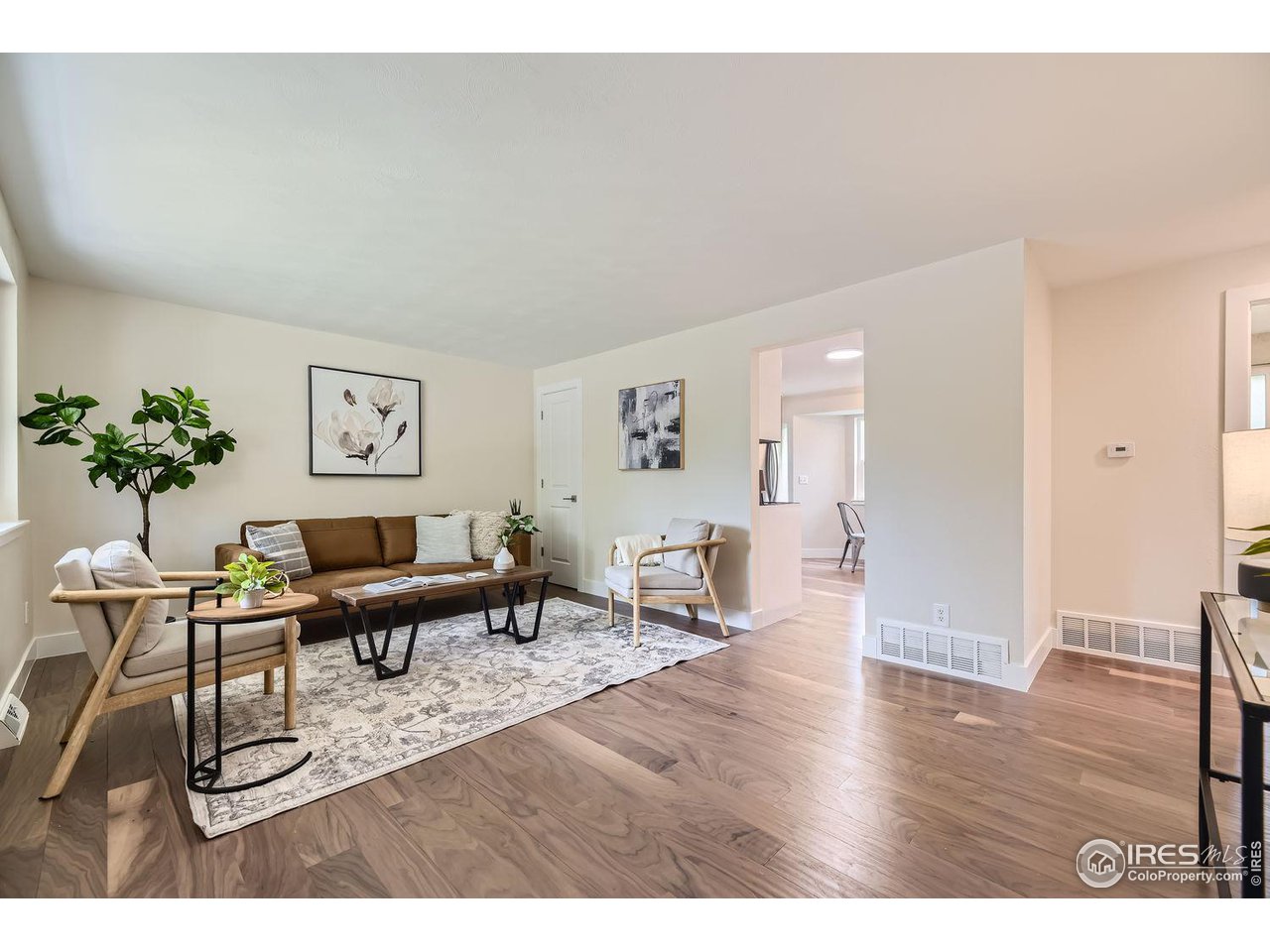 1505 Findlay Way Boulder, CO 80305 - Photo 4 of 31 a living room with furniture and wooden floor